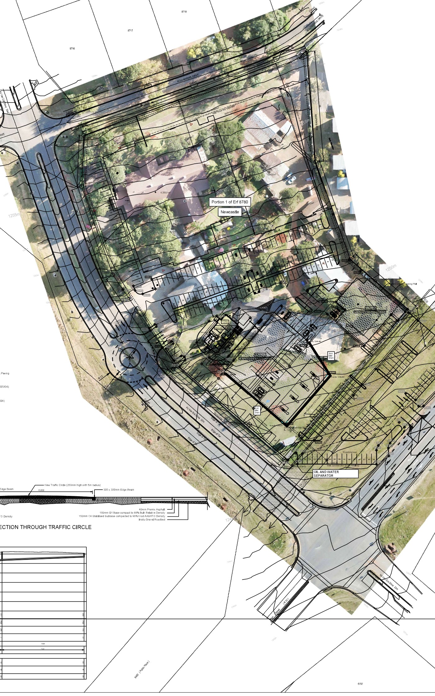 The Pines Crossing layout plan: roads, parking and a traffic circle drawn over an aerial photo of the site