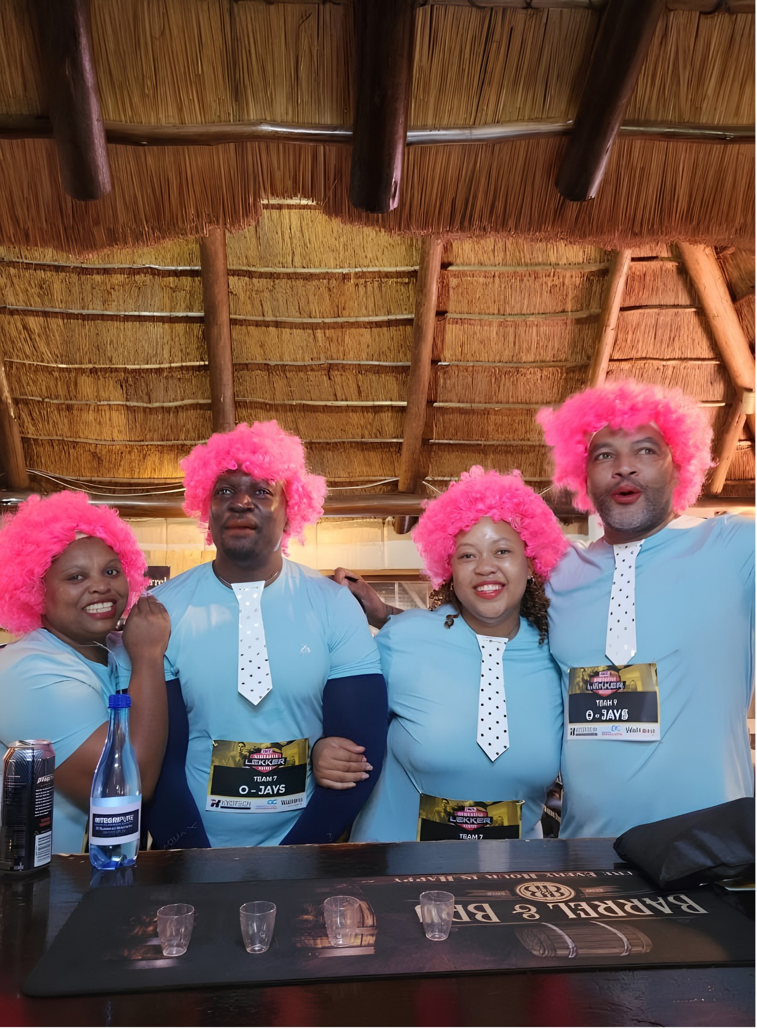 Team O-Jays in pink wigs and painted-on ties at the Barrel & Bru bar during the 2026 Lekker Resies