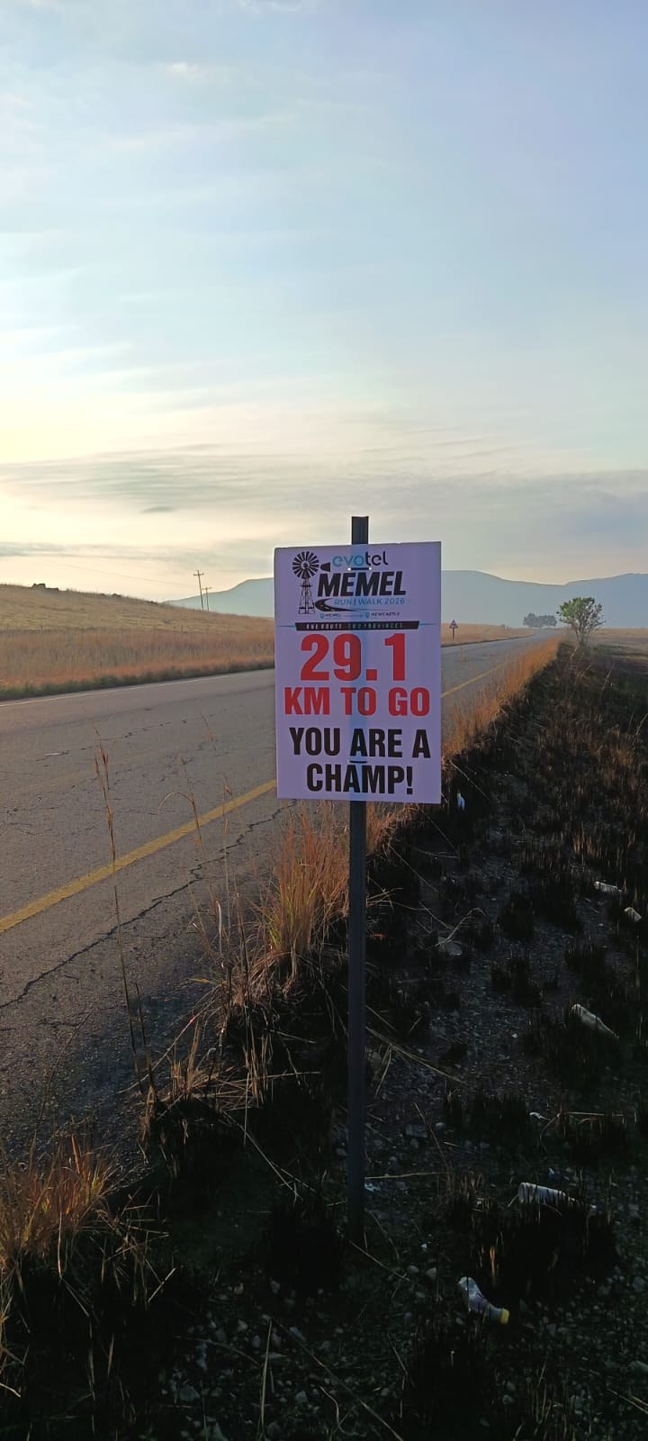 A Memel Run/Walk 2026 roadside sign: 29.1 km to go, you are a champ!