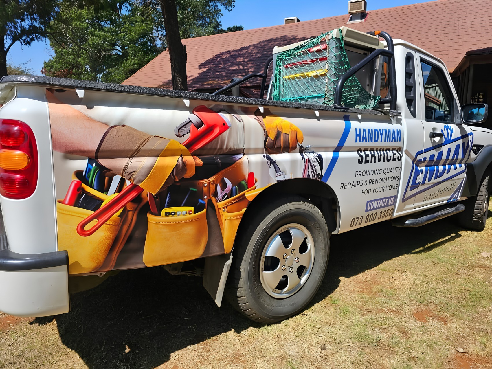 A bakkie wrapped by The Print Lab for a handyman business, a tool belt and wrench printed along the load bin